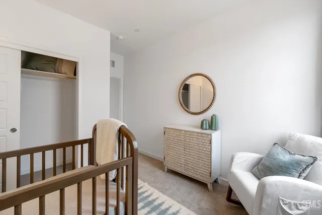 a living room with furniture a mirror and a window