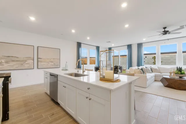 a room with sink washer and dryer