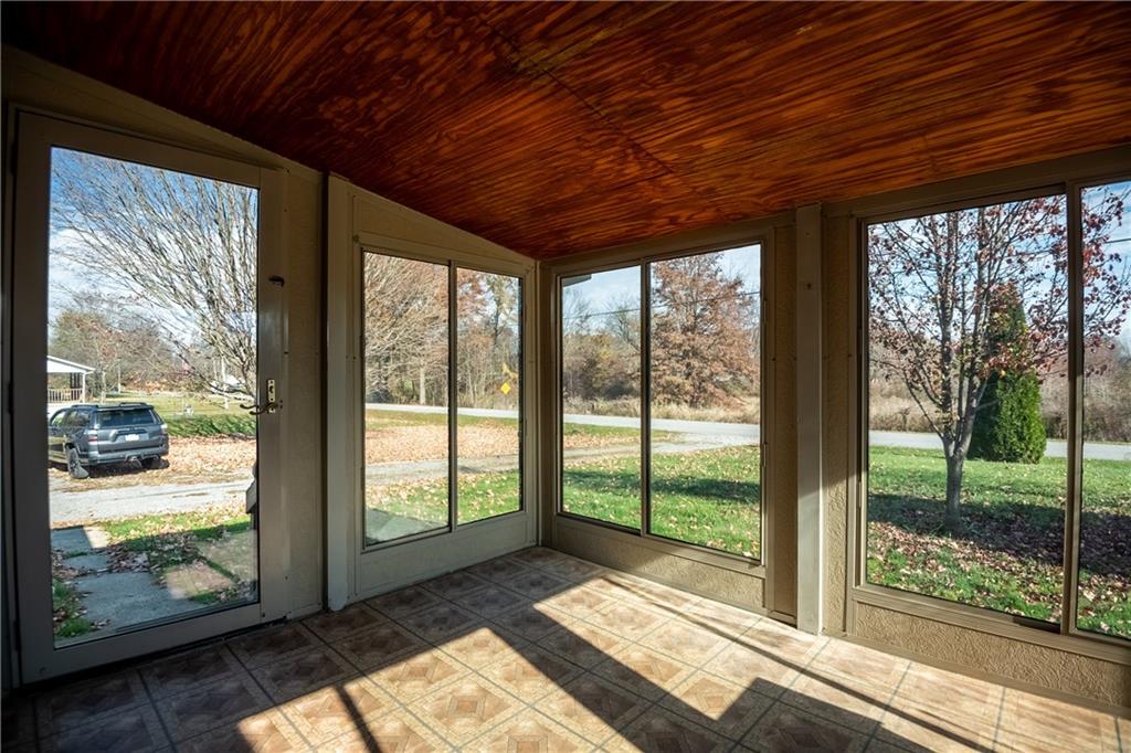 183 Grange Road Pulaski, PA 16143 - Photo 16 of 25 enclosed porch on the front of the home