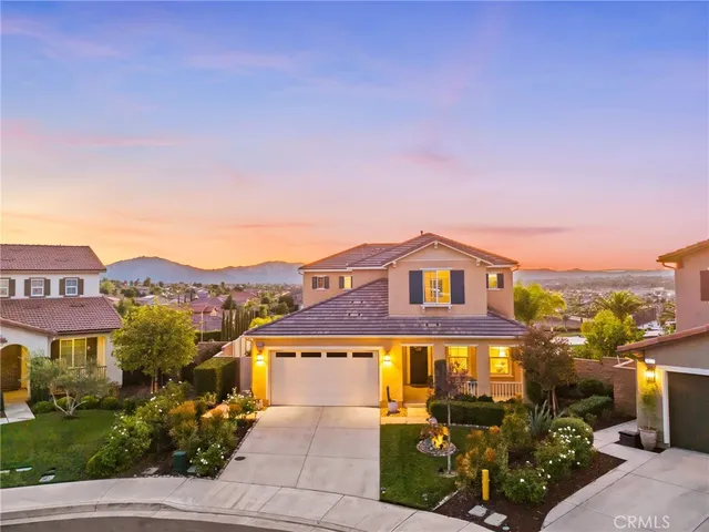 an aerial view of residential houses with city view
