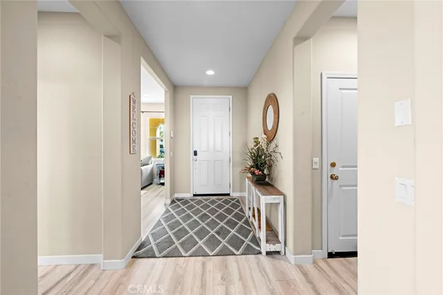 a bedroom with a bed and painting on the wall