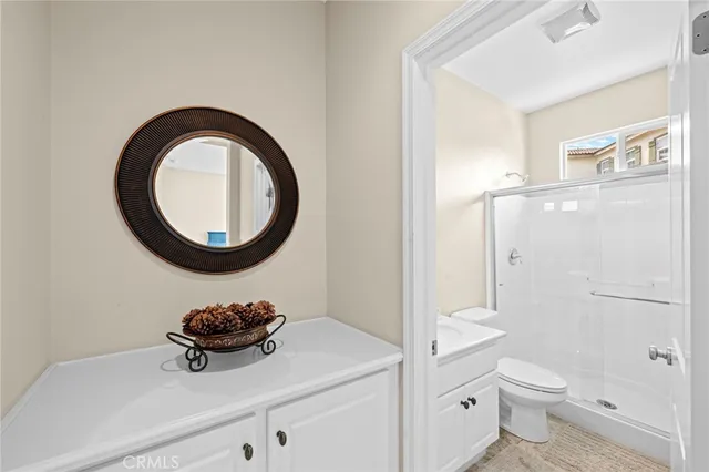 a spacious bathroom with a double vanity sink a mirror and a bathtub