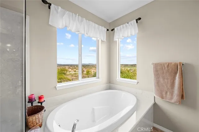 a bedroom with a bed chair and a window