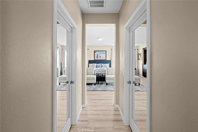 a view of a house with backyard water fountain and sitting area