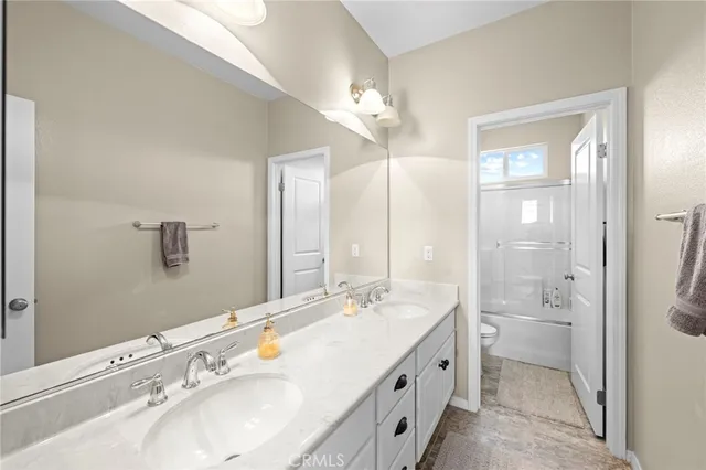 a roof deck with table and chairs and ocean view