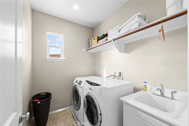 an aerial view of a house with garden space and street view