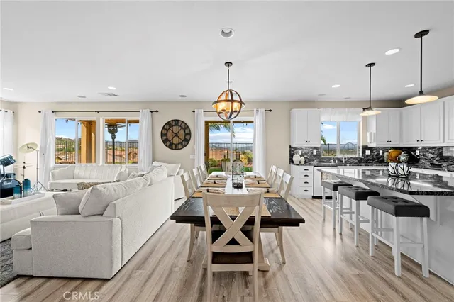 a view of a dining room with furniture window and outside view