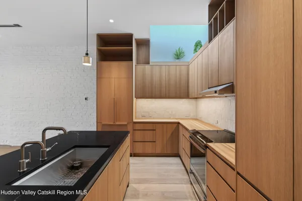 a kitchen with a sink and cabinets