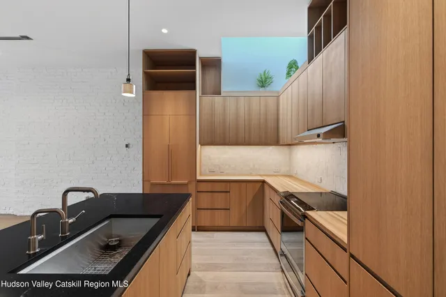 a kitchen with a sink and cabinets