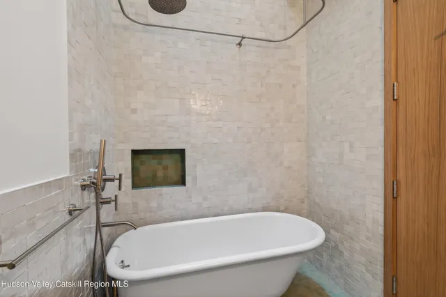 a bathroom with a white bath tub