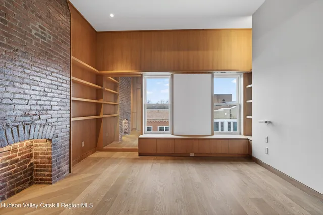 a bedroom with bed and window