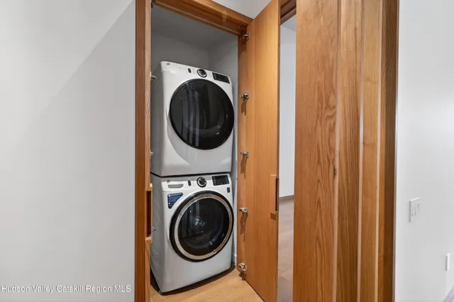 a view of a hallway with washer and dryer
