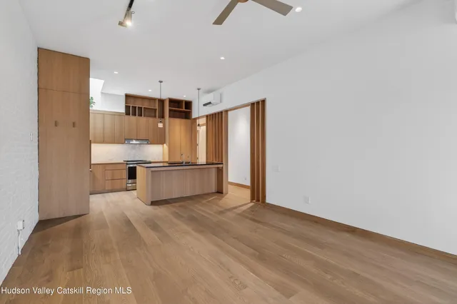 a view of kitchen with wooden floor