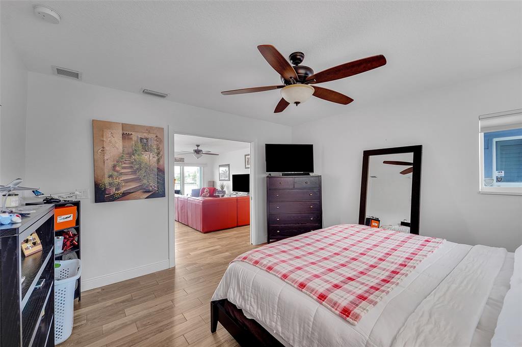 1201 South Riverside Drive, Unit 204 Pompano Beach, FL 33062 - Photo 20 of 48 a bedroom with a bed and dresser