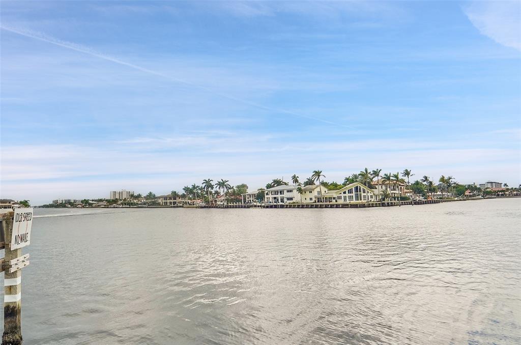 1201 South Riverside Drive, Unit 204 Pompano Beach, FL 33062 - Photo 27 of 48 a view of a lake with houses in the back