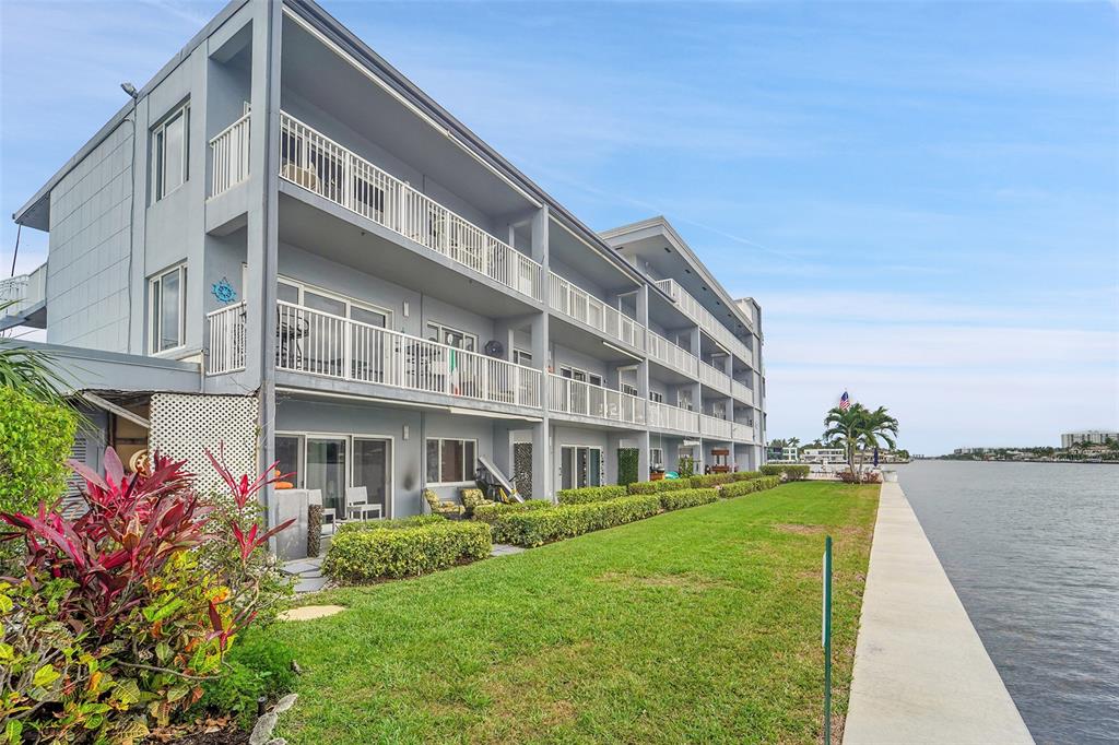 1201 South Riverside Drive, Unit 204 Pompano Beach, FL 33062 - Photo 29 of 48 a view of a building with a yard