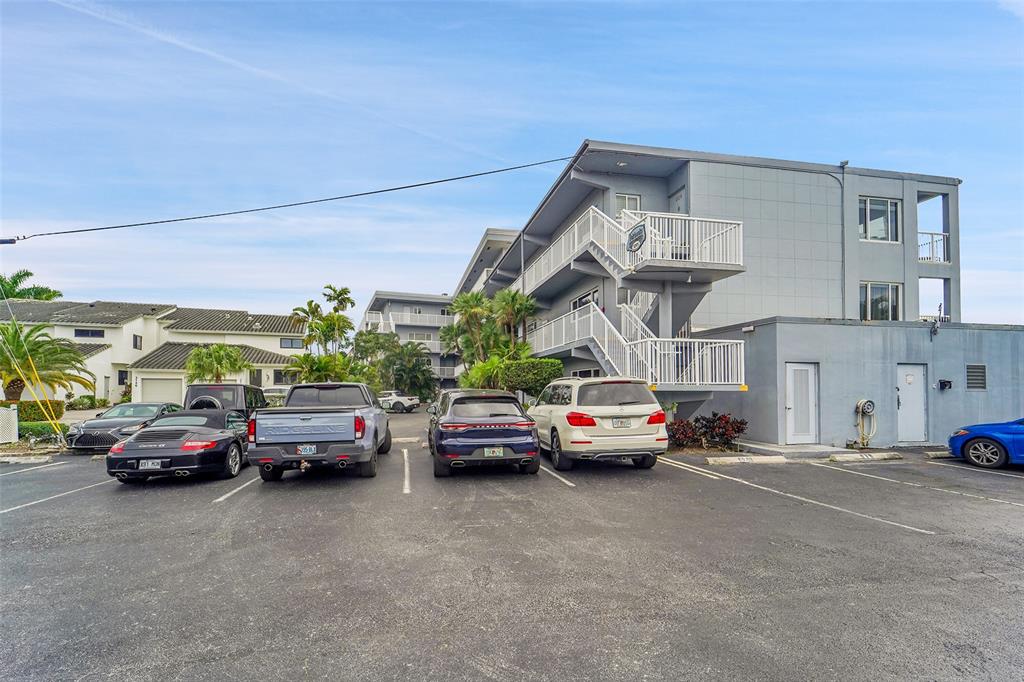 1201 South Riverside Drive, Unit 204 Pompano Beach, FL 33062 - Photo 5 of 48 a view of cars parked in front of a building
