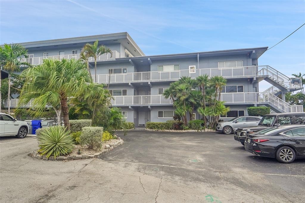 1201 South Riverside Drive, Unit 204 Pompano Beach, FL 33062 - Photo 6 of 48 a view of a car parked in front of a building