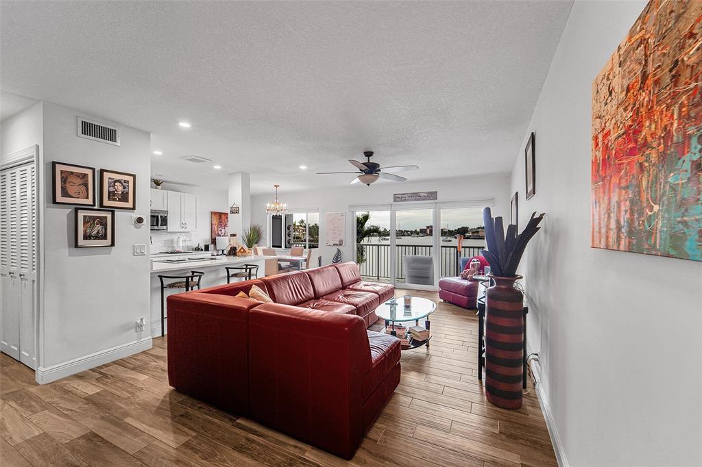 1201 South Riverside Drive, Unit 204 Pompano Beach, FL 33062 - Photo 9 of 48 a living room with furniture and a wooden floor