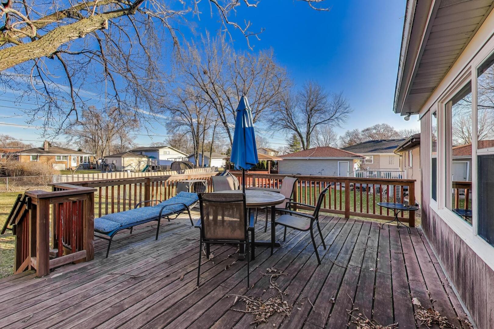 4N405 2nd Avenue Addison, IL 60101 - Photo 27 of 30 a view of a roof deck with table and chairs wooden floor and fence