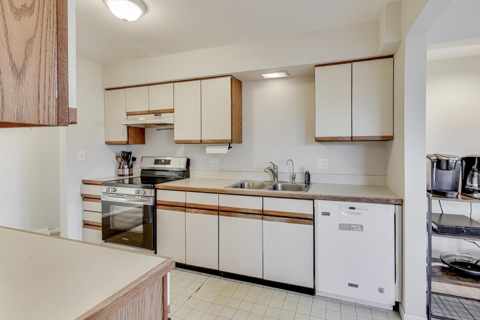 4N405 2nd Avenue Addison, IL 60101 - Photo 6 of 30 a kitchen with cabinets appliances a sink and a counter top space