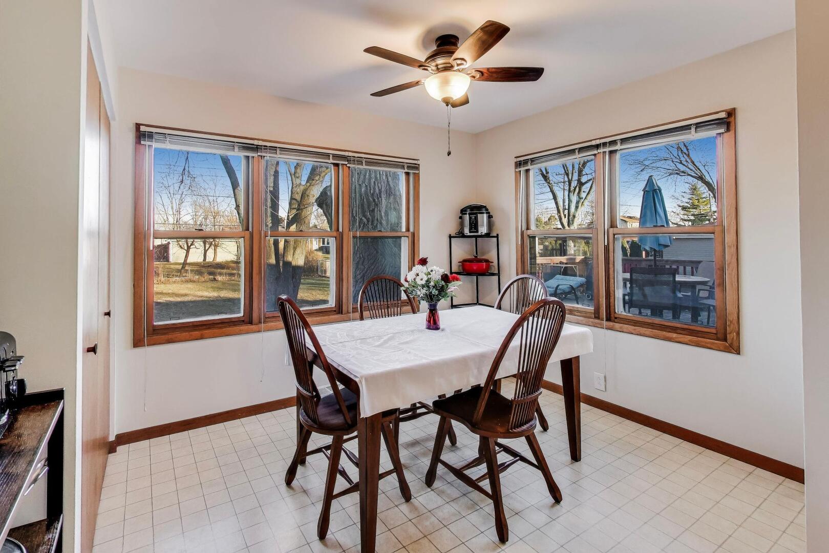 4N405 2nd Avenue Addison, IL 60101 - Photo 8 of 30 a view of a dining room with furniture window and wooden floor
