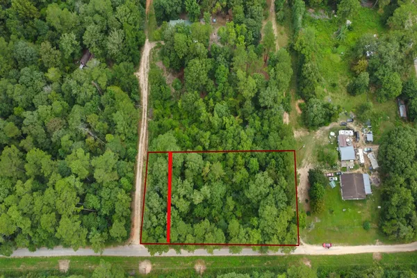 a view of a yard with a street view