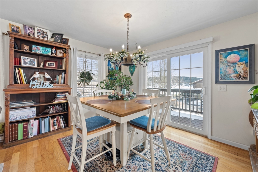 5 Glen Echo Shore Road Charlton, MA 01507 - Photo 12 of 42 a view of a dining room with furniture and a book shelf