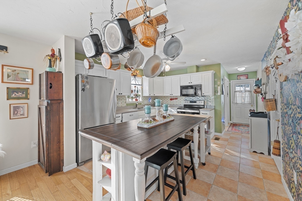 5 Glen Echo Shore Road Charlton, MA 01507 - Photo 15 of 42 a kitchen with stainless steel appliances granite countertop a sink a refrigerator and a stove