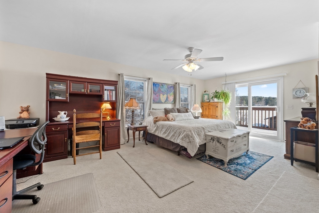 5 Glen Echo Shore Road Charlton, MA 01507 - Photo 25 of 42 a bedroom with a bed and a chandelier