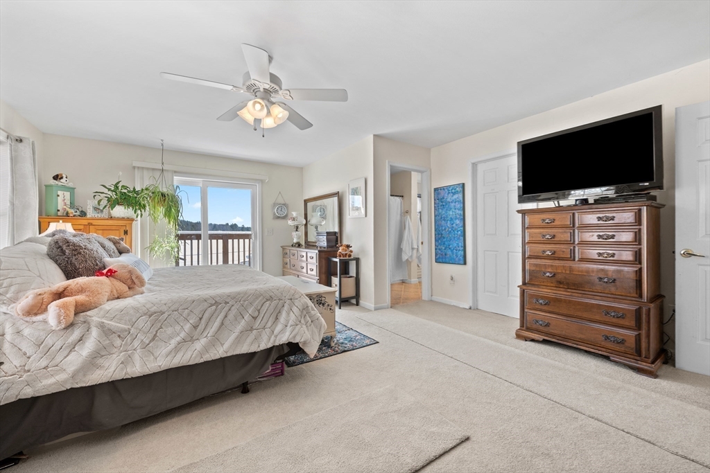 5 Glen Echo Shore Road Charlton, MA 01507 - Photo 26 of 42 a bedroom with a bed and a flat screen tv