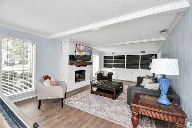 a living room with furniture and a window