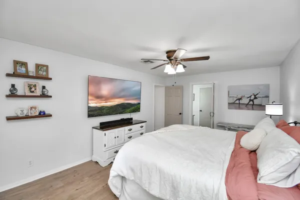 a bedroom with a bed and window