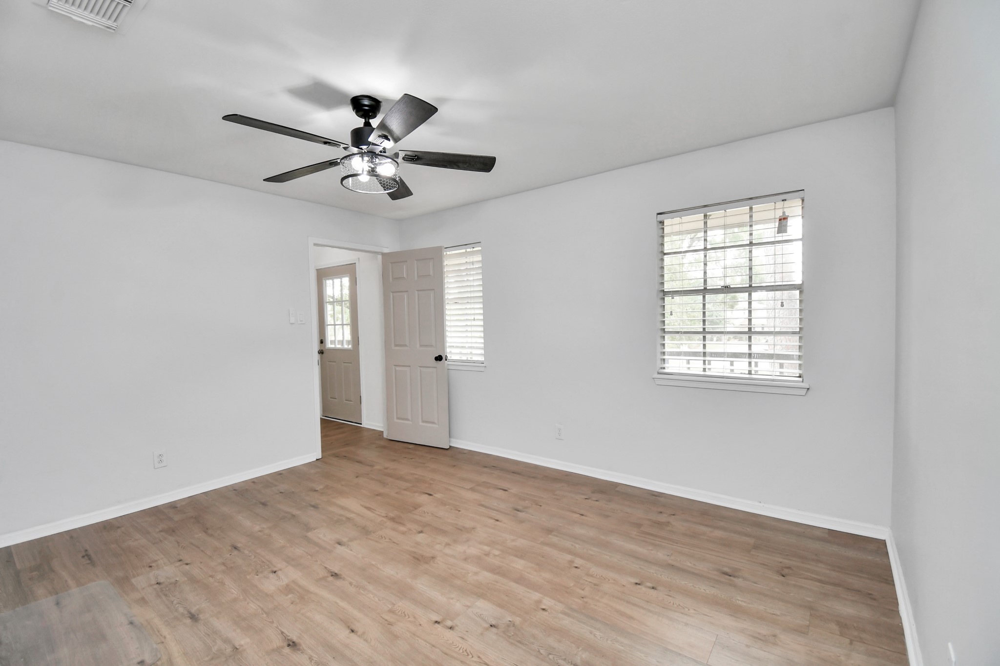 7502 Ralick Court Spring, TX 77379 - Photo 35 of 42 wooden floor in an empty room with a window