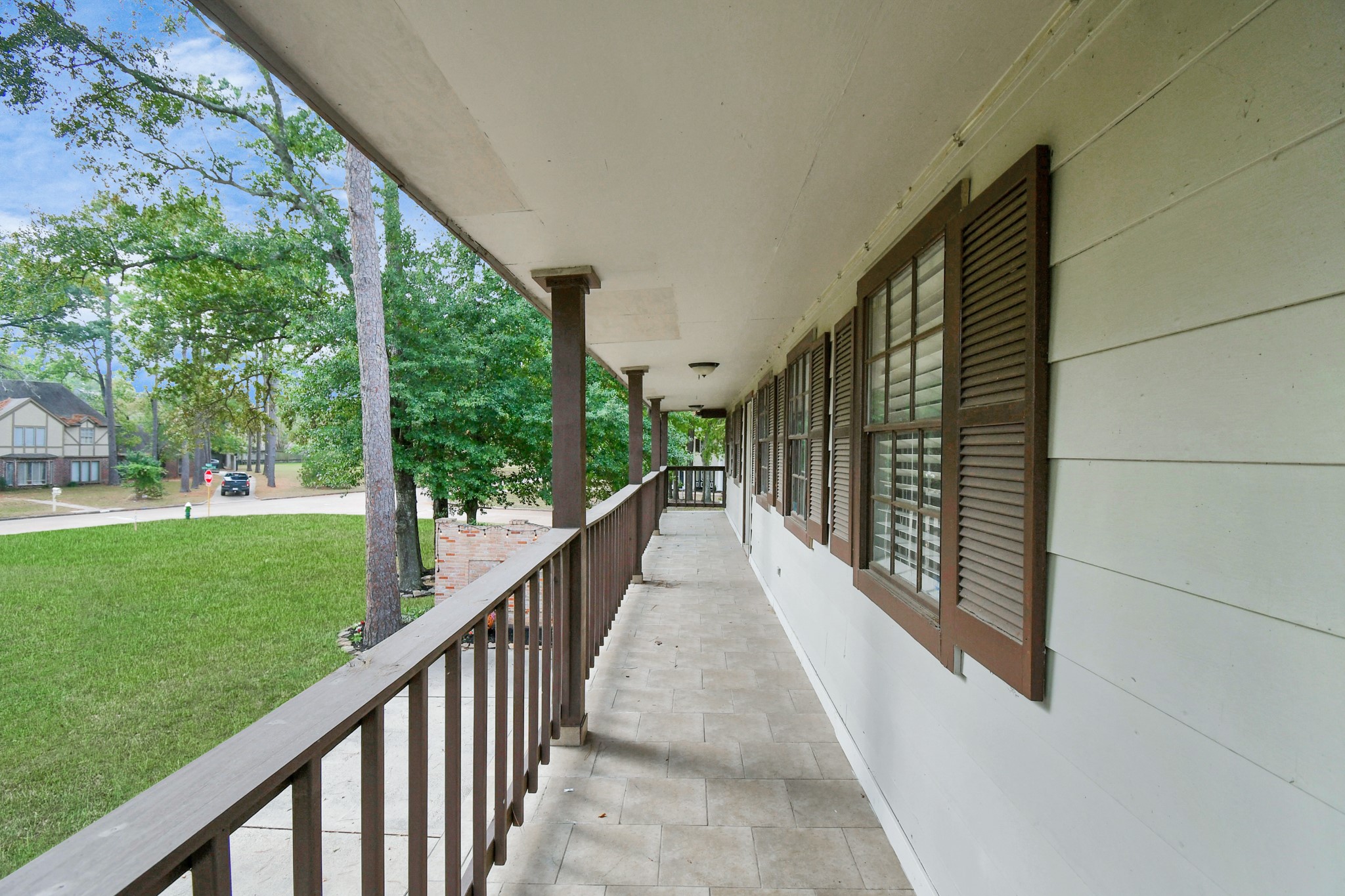7502 Ralick Court Spring, TX 77379 - Photo 37 of 42 a view of balcony with wooden floor and fence