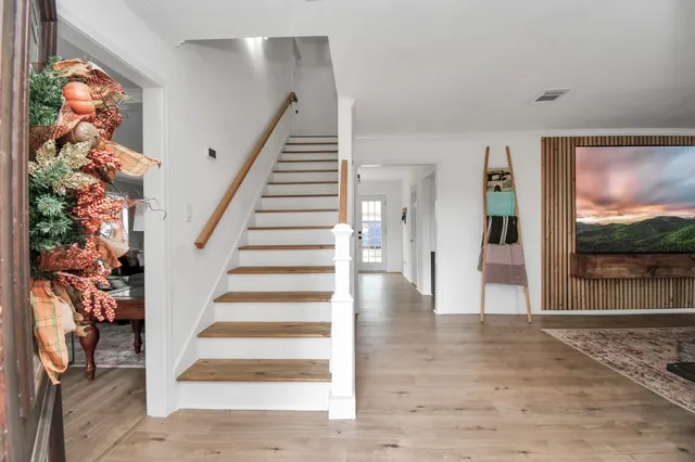 a view of entryway with wooden floor