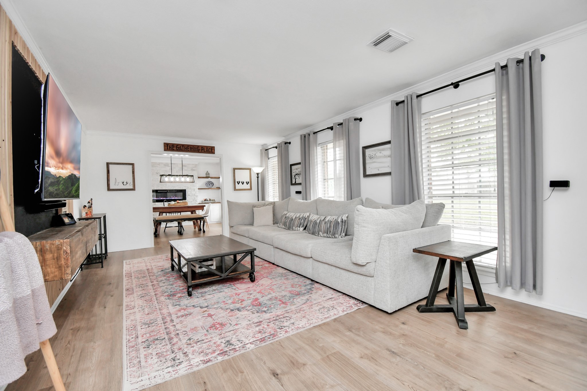 7502 Ralick Court Spring, TX 77379 - Photo 8 of 43 a living room with furniture and a flat screen tv