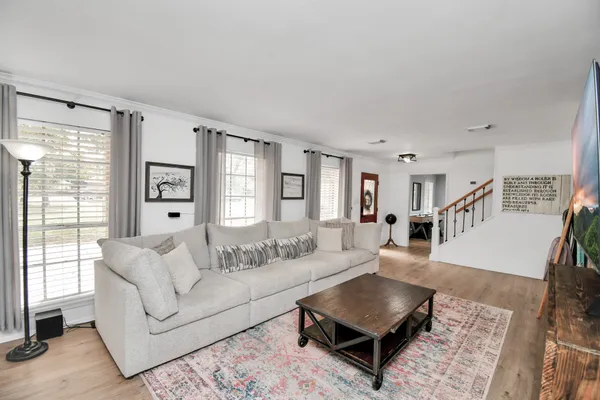 a living room with furniture and a flat screen tv