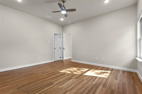 a kitchen with stainless steel appliances kitchen island granite countertop a stove a sink and a refrigerator