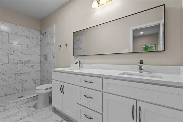 a view of kitchen with wooden floor and electronic appliances