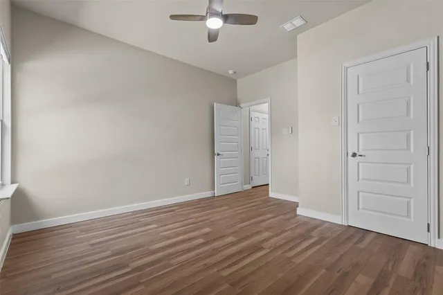 a bathroom with a double vanity sink toilet and a mirror