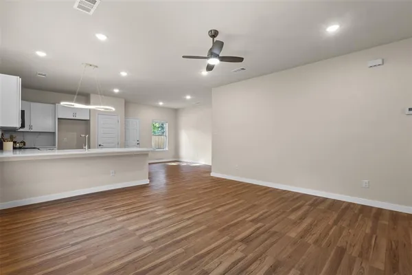 a view of kitchen view with wooden floor and window