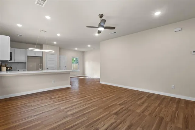 a view of kitchen view with wooden floor and window