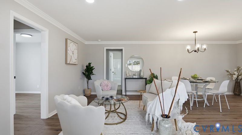 25209 Ritchie Avenue Petersburg, VA 23803 - Photo 17 of 50 Living area featuring ornamental molding, a chande