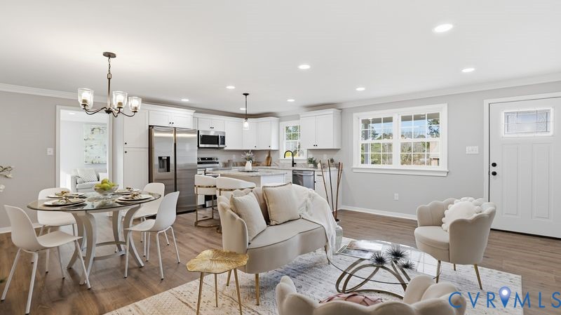 25209 Ritchie Avenue Petersburg, VA 23803 - Photo 19 of 50 Living area featuring ornamental molding, a chande