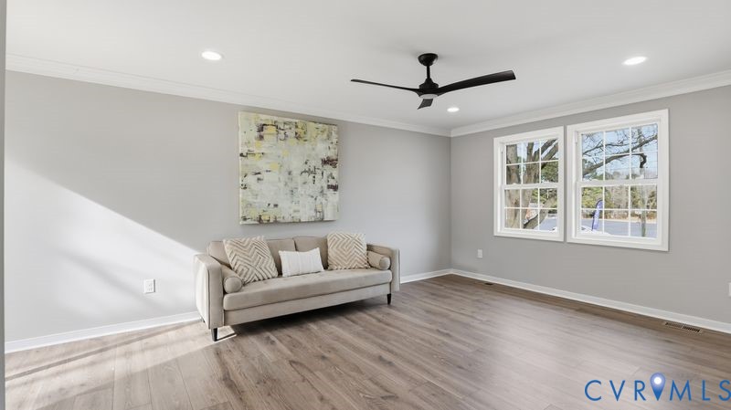 25209 Ritchie Avenue Petersburg, VA 23803 - Photo 24 of 50 Living area with ceiling fan, crown molding, light