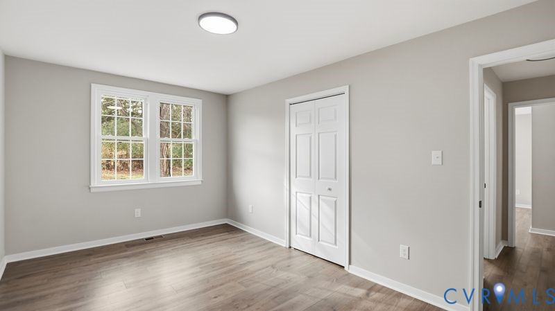 25209 Ritchie Avenue Petersburg, VA 23803 - Photo 31 of 50 Unfurnished bedroom featuring wood finished floors