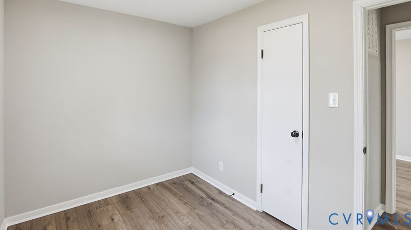 25209 Ritchie Avenue Petersburg, VA 23803 - Photo 36 of 50 Unfurnished bedroom featuring wood finished floors