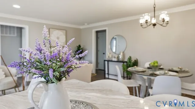 a vase of flowers sitting on a dining table