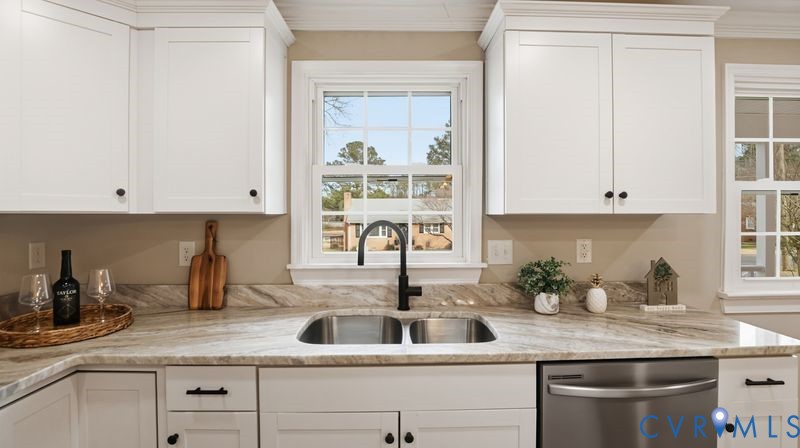 25209 Ritchie Avenue Petersburg, VA 23803 - Photo 9 of 50 Kitchen with white cabinets, dishwasher, and light